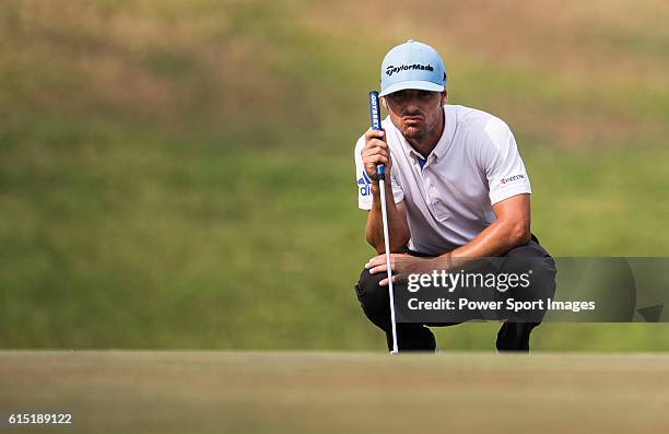 Javi Colomo of Spain lines a putt during round four of the 2016 Venetian Macao Open at Macau Golf and Country Club on October 16, 2016 in Macau,...