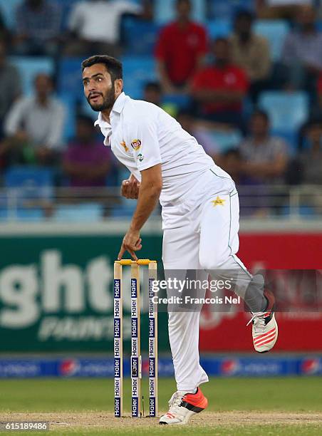 Mohammad Nawaz of Pakistan bowls during Day Five of the First Test between Pakistan and West Indies at Dubai International Cricket Ground on October...