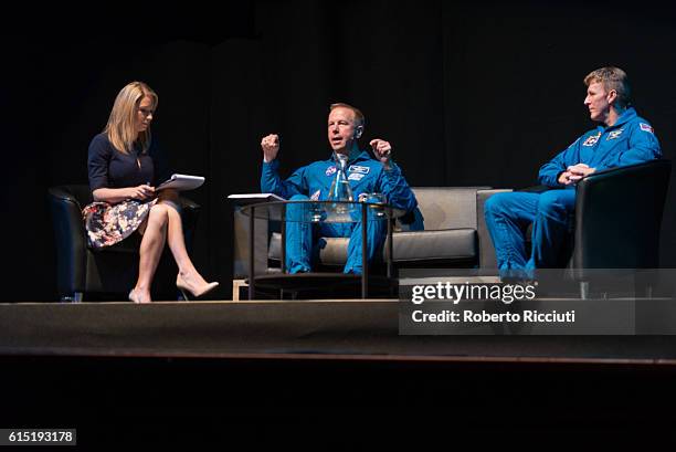 English space journalist Sarah Cruddas, American NASA astronaut Tim Kopra and British ESA astronaut Tim Peake on stage for "Experiments in space" at...