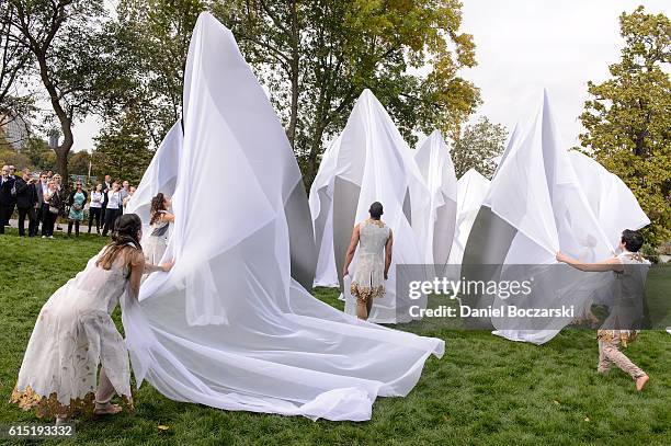 Dancers from Thodos Dance Chicago unveil the Project 120 Skylanding art installation at Jackson Park on October 17, 2016 in Chicago, Illinois.