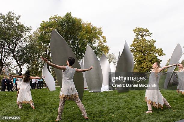 Dancers from Thodos Dance Chicago unveil the Project 120 Skylanding art installation at Jackson Park on October 17, 2016 in Chicago, Illinois.