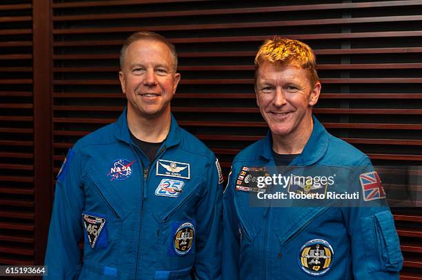 American NASA astronaut Tim Kopra and British ESA astronaut Tim Peake pose for a photo after attending "Experiments in space" at Usher Hall on...