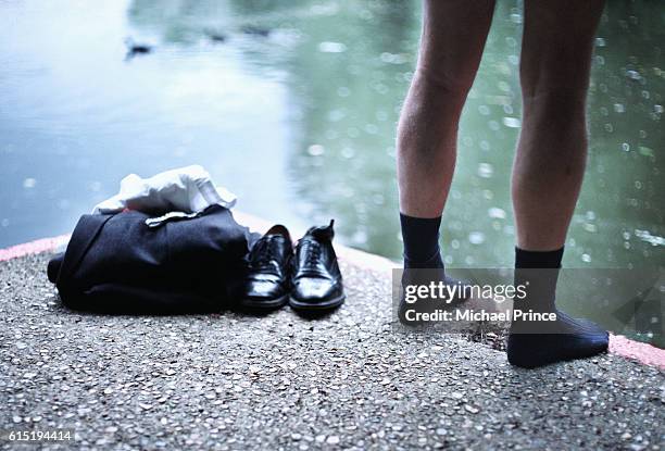 businessman taking plunge - skinny dipping stock-fotos und bilder