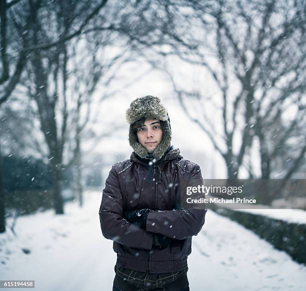 portrait of man in snowy landscape - 毛皮の帽子 ストックフォトと画像
