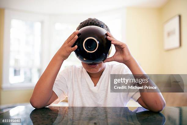 boy (10-12) eating from bowl - bowl of soup stockfoto's en -beelden