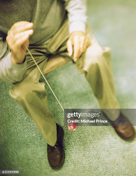 man playing with yo-yo - yo yo stock pictures, royalty-free photos & images