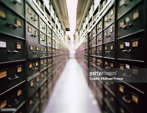 long rows of file cabinets - archivo fotografías e imágenes de stock