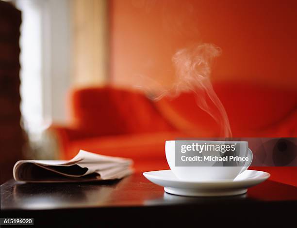 coffee cup on table - coffee and news paper foto e immagini stock