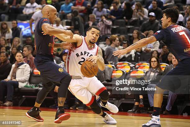 Toronto Raptors vs San Lorenzo at ACC Toronto Raptors Fred VanVleet goes by San Lorenzo's Guillermo Diaz and Gustavo Nicolas Aguirre at the Air...