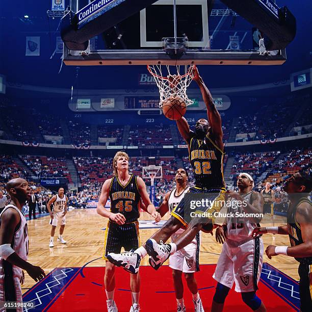 Dale Davis of the Indiana Pacers dunks against the New Jersey Nets circa 1997 at the Contintental Airlines Arena in East Rutherford, New Jersey. NOTE...