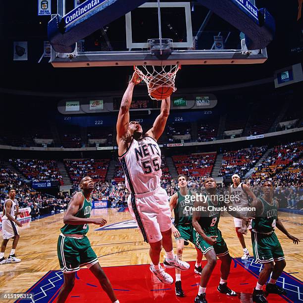 Jayson Williams of the New Jersey Nets dunks against the Boston Celtics circa 1997 at the Contintental Airlines Arena in East Rutherford, New Jersey....