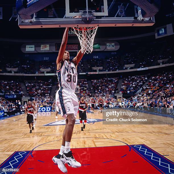 Kerry Kittles of the New Jersey Nets dunks against the Portland Trail Blazers circa 1997 at the Contintental Airlines Arena in East Rutherford, New...