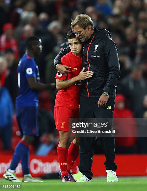 Jurgen Klopp, Manager of Liverpool talks with Philippe Coutinho of Liverpool after the Premier League match between Liverpool and Manchester United...
