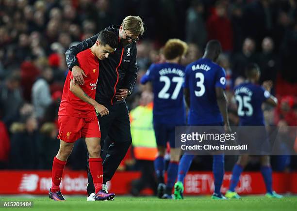 Jurgen Klopp, Manager of Liverpool talks with Philippe Coutinho of Liverpool after the Premier League match between Liverpool and Manchester United...