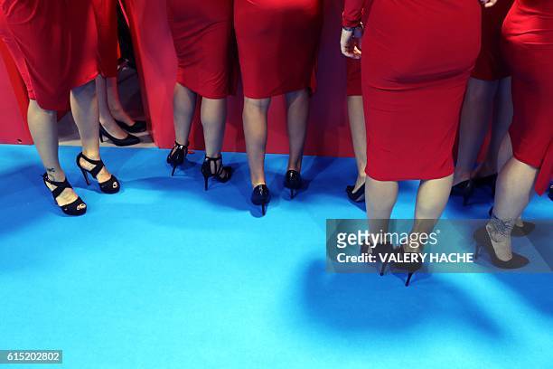 Legs of hostesses are pictured during the world's entertainment content market , on October 17, 2016 in Cannes, southeastern France. / AFP / VALERY...