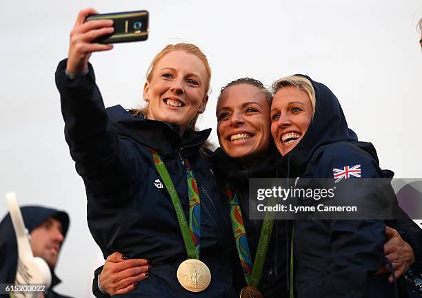 Nicola White , Kate Richardson-Walsh and Alex Danson of Great Britain take a picture during a Rio 2016 Victory Parade for the British Olympic and...