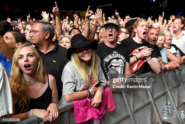 The Rolling Stones music fans watch the band perform during Desert Trip at The Empire Polo Club on October 14, 2016 in Indio, California.