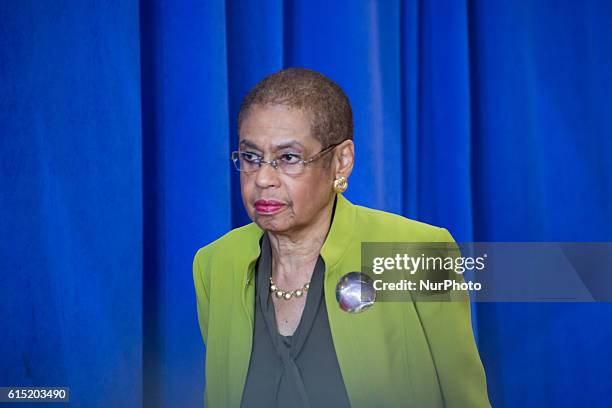 Rep. Eleanor Holmes Norton makes her way to her seat, before President Barack Obama spoke at Benjamin Banneker Academic High School to highlight the...