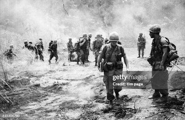 Members of the United States 173rd Airborne Division on patrol in War Zone D. Vietnam, 1965. | Location: War Zone D, Vietnam.