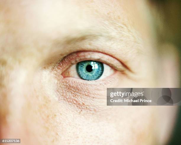 man's blue eye - teal portrait stockfoto's en -beelden