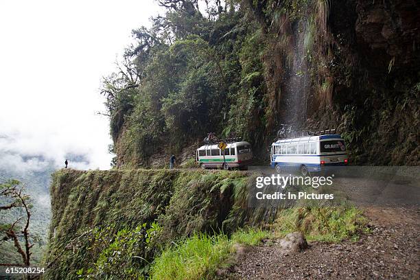 Bus van support vehicle driving for mountain bikers on 'the World's most dangerous road' down to Coroico in the Yungas, La Paz province, Bolivia.