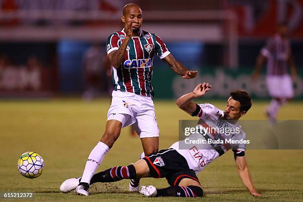 Wellington Silva of Fluminense struggles for the ball with Rodrigo Caio of Sao Paulo during a match between Fluminense and Sao Paulo as part of...