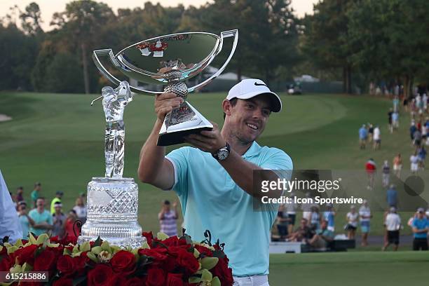 Rory McIlroy holds up the Fedex Cup trophy after winning on the 4th playoff hole at the final round of the 2016 PGA Tour Championship at East Lake...