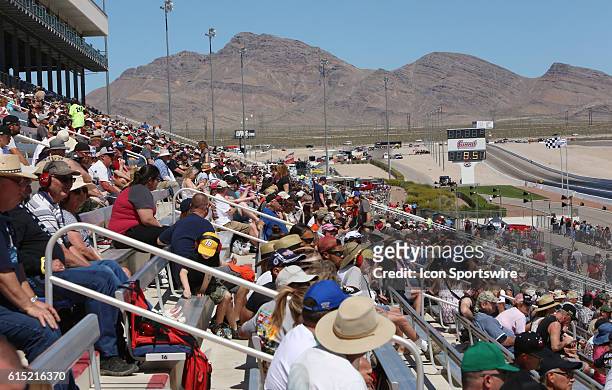 Fans watch the 2016 DENSO Spark Plugs NHRA Nationals Drag Race at Las Vegas Speedway The Strip at Las Vegas Motor Speedway Saturday, April 2, 2015.