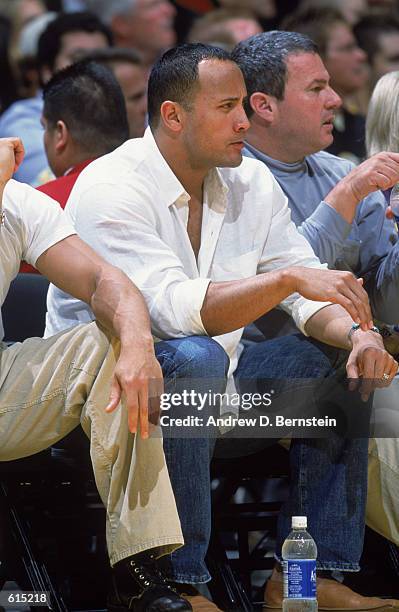 Celebrity fan Dwayne Johnson, a.k.a The Rock, watches play during Game 4 of the 2002 NBA Western Conference Finals between the Sacramento Kings and...