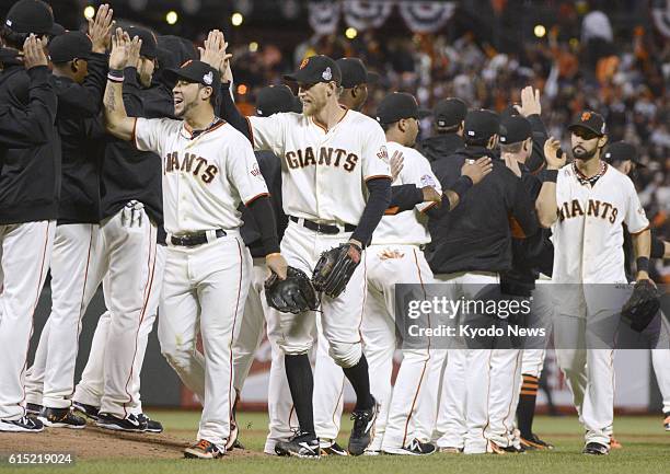 United States - San Francisco Giants players celebrate after beating the Detroit Tigers 8-3 in Game 1 of the major league World Series at AT&T Park...