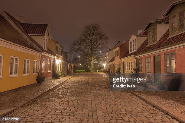 old precinct of odense at night, the street of fairy tale, denmark - blue house red door stock pictures, royalty-free photos & images