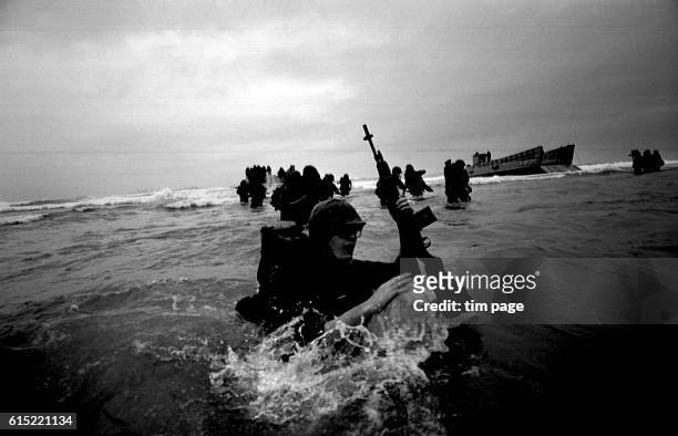 United States Marines wade ashore at Tam Ky during Operation Colorado. Central Vietnam, 1965.