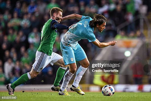 March 2016; Steve Davis, Northern Ireland, in action against Rene Krhin, Slovenia. International Friendly, Northern Ireland v Slovenia. National...