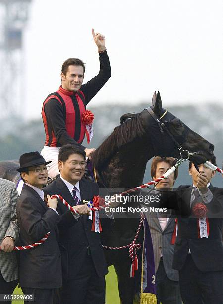Japan - Jockey Mirco Demuro on Eishin Flash celebrates after the horse won the Tenno-sho at Tokyo Racecourse on Oct. 28, 2012. Fifth choice Eishin...