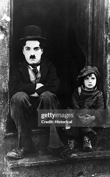 Silent movie star Charlie Chaplin, with co-star Jackie Coogan in a still frame of the movie "The Kid." The 1921 film made Coogan famous and...