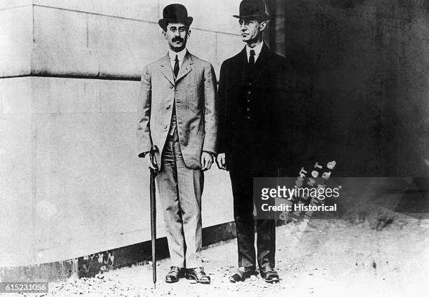 Portrait of the Wright Brothers, first to develop powered heavier-than-air flight. Wilbur stands on the left.
