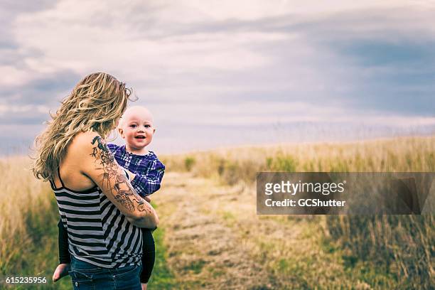 mum, look who is coming? - coming back stock pictures, royalty-free photos & images