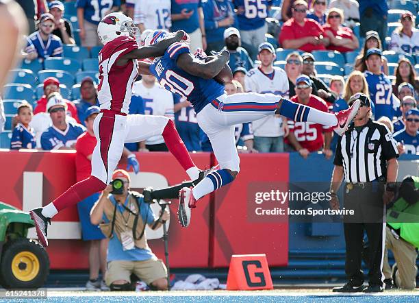 Buffalo Bills defensive back Corey White intercepts Arizona Cardinals quarterback Carson Palmer pass in front od Arizona Cardinals wide receiver...