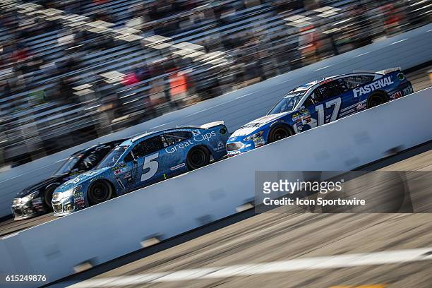 Sprint Cup Series drivers Kasey Kahne, driver of the Chevrolet and Rick Stenhouse Jr, driver of the Ford on the front stretch at the Bad Boy Off Road...
