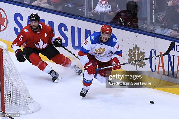 Team Russia Forward Nikolay Kulemin and Team Canada Defenceman Shea Weber in action during the WHOC semi final game between Team Russia and Team...