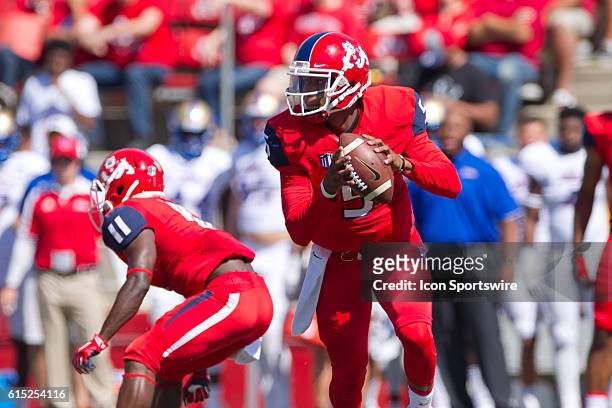 Fresno State Bulldogs quarterback Chason Virgil rolls out of the pocket during the game between the Fresno State Bulldogs and the Tulsa Golden...