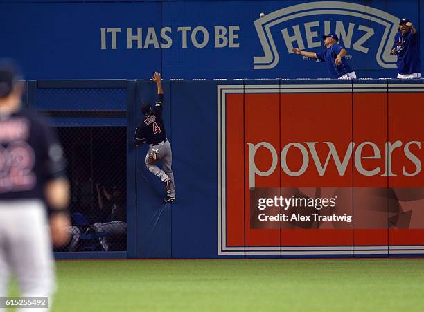 Coco Crisp of the Cleveland Indians can't catch the ball off the bat of Michael Saunders in the bottom of the second inning of ALCS Game 3 against...