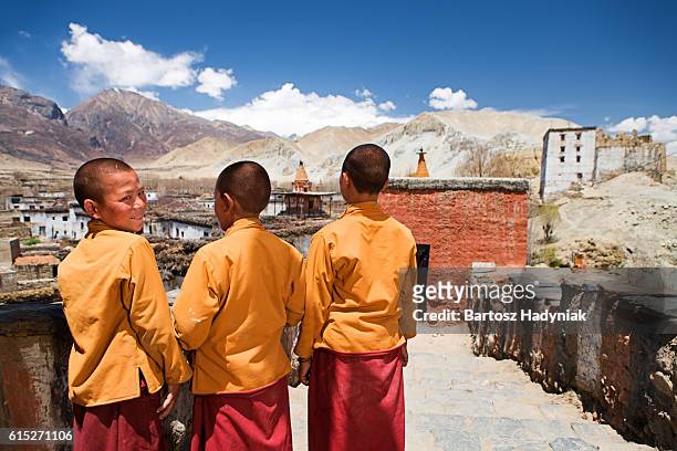 three young novice monks in tibetan monastery, upper mustang - tibet stock pictures, royalty-free photos & images