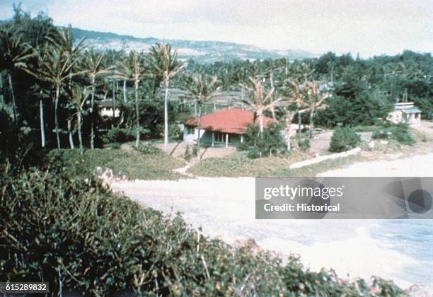 Tsunami generated thousands of miles away in the Aleutian Islands washes over Laie Point on Oahu.