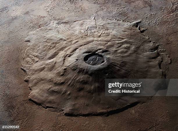 Orbital view of the Olympus Mons volcano on Mars, the largest known volcano in the solar system. It measures 375 miles across at its base, and the...