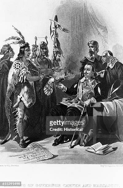 Massasoit meets with Governor John Carver while other North American men stand nearby. Carver was the first governor of the Plymouth colony in 1620....
