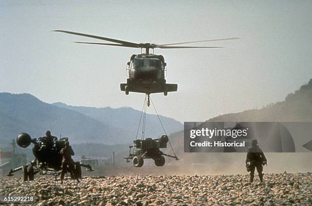 Black Hawk brings in an M-167 towed Vulcan Air Defense System as the crew of a second VADS prepares their weapon for action during the joint South...