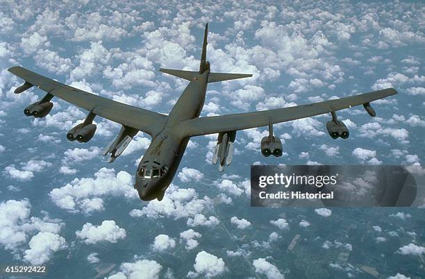 An air-to-air front view of a B-52G Stratofortress aircraft from the 416th Bombardment Wing armed with AGM-86B air-launched cruise missiles . 1988.