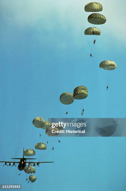 Army paratroopers jump from a C-130 Hercules aircraft to begin a week-long series of events marking the 45th anniversary of the Allied invasion of...