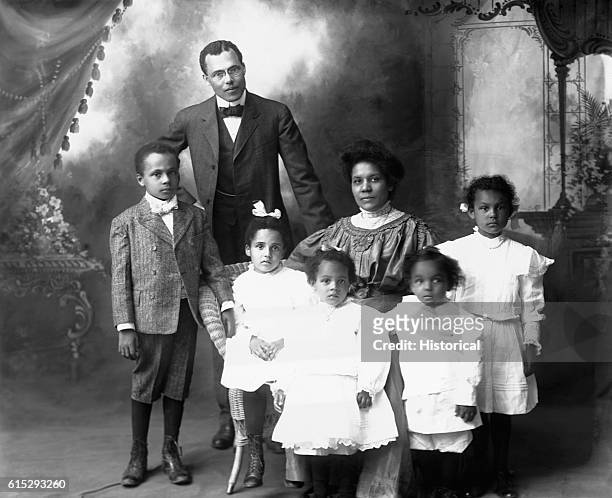 Emmet J. Scott poses for a portrait with his wife, son, and four daughters at Tuskegee Institute in Alabama.